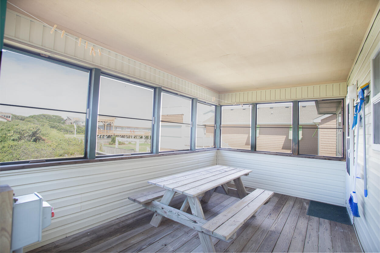 Screened-in porch with picnic table